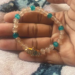 Glass beaded bracelet, beige n turquoise w bedazzle hand charm. Home made!